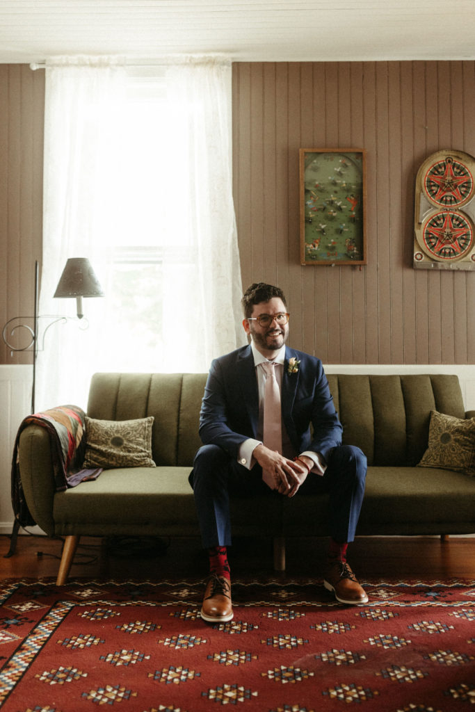A groom sitting on his wedding day.