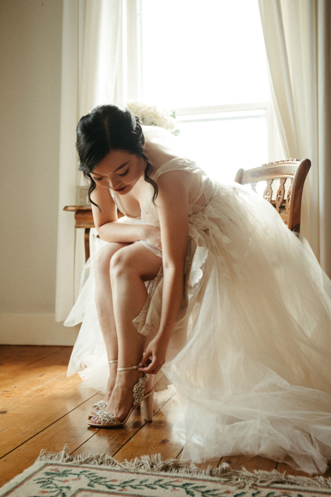 A bride getting dressed on her wedding day.