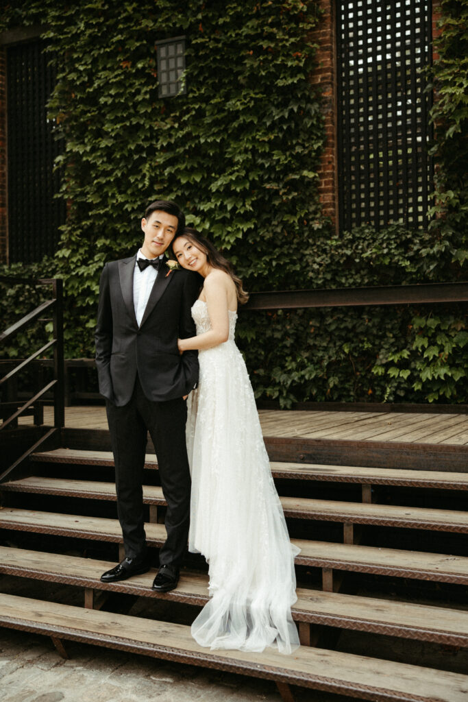 The groom in an Enzo Custom suit, the bride radiant in a Designer Loft gown—timeless elegance captured in the heart of NYC.
