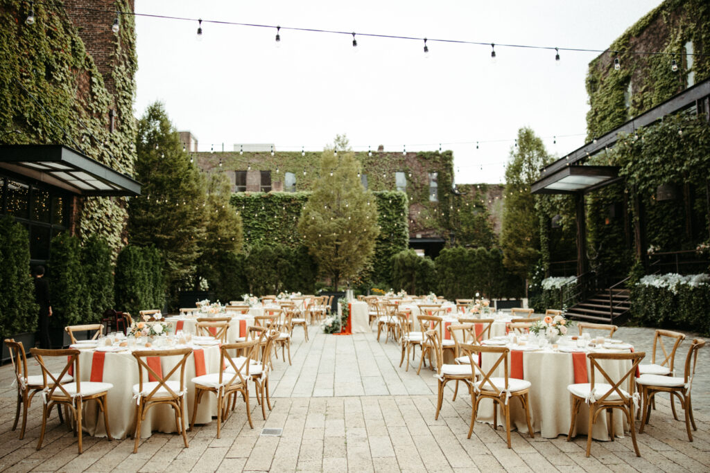 The courtyard transforms seamlessly from vows to an open-air reception, a vibrant celebration catered by Bartleby and Sage.