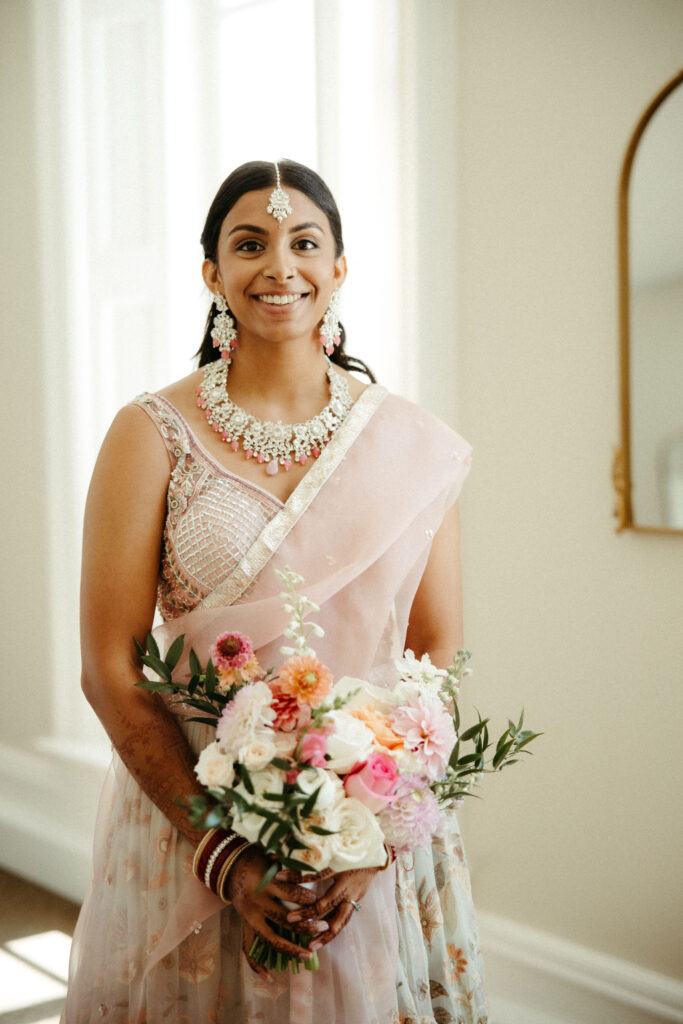 The bride's stunning bridal attire, featuring intricate embroidery and vibrant colors, reflecting her cultural heritage.
