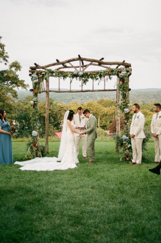 Outdoor Ceremony Views: Majestic mountain views frame the outdoor ceremony at Red Maple Vineyard, adding natural beauty to the celebration.
