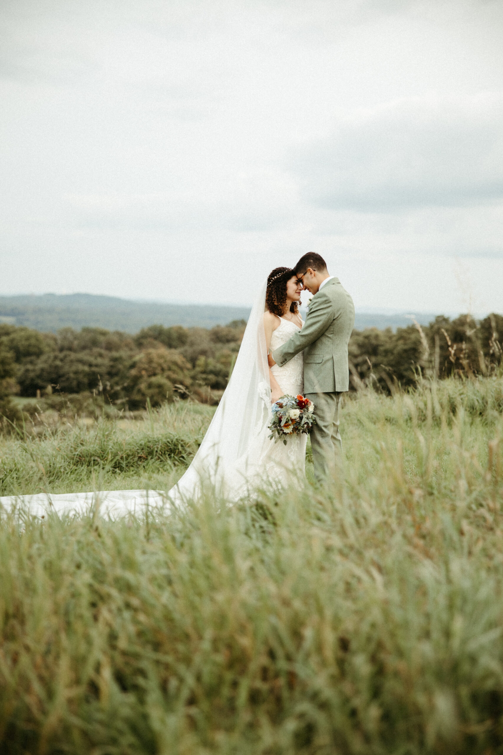 Majestic mountain views frame the couple at Red Maple Vineyard, adding natural beauty to the celebration.