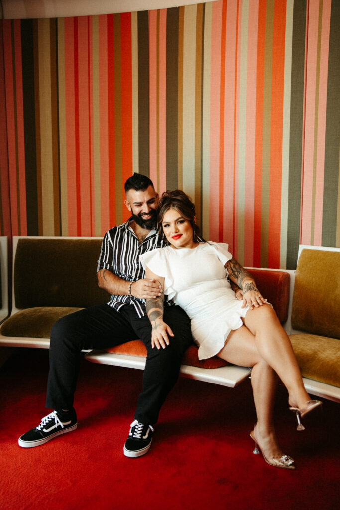 Couple sharing a quiet moment in the iconic mid-century modern lounge at the TWA Hotel.