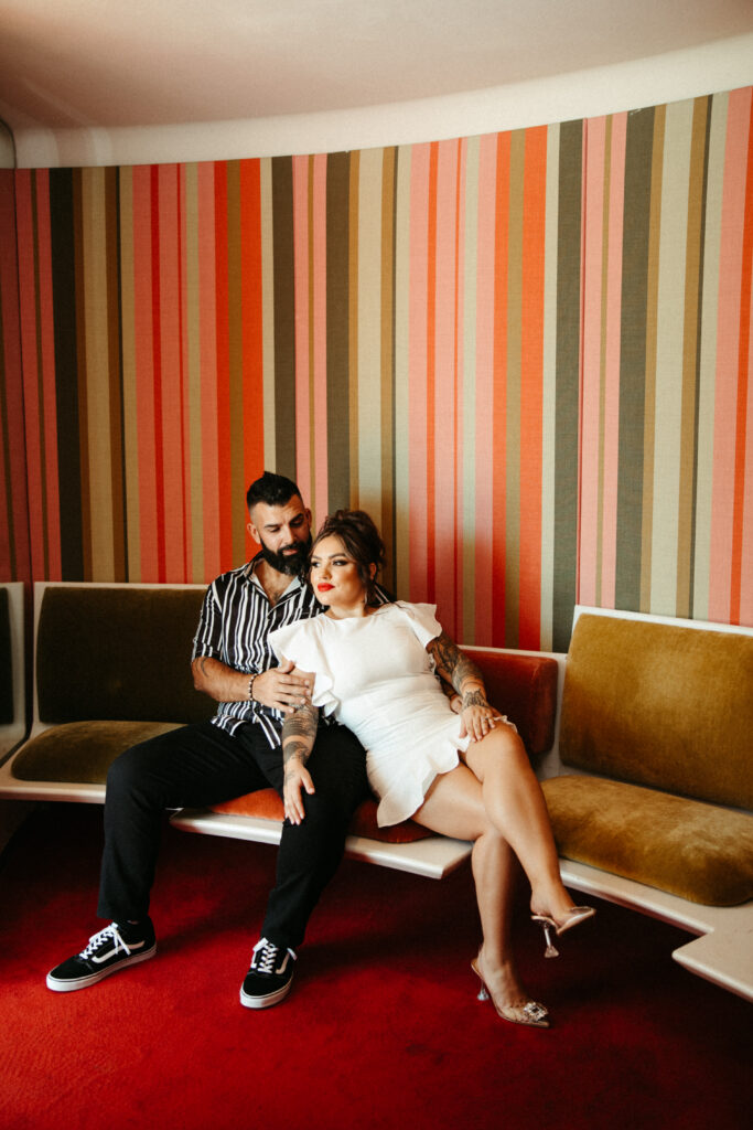 Couple sharing a quiet moment in the iconic mid-century modern lounge at the TWA Hotel.