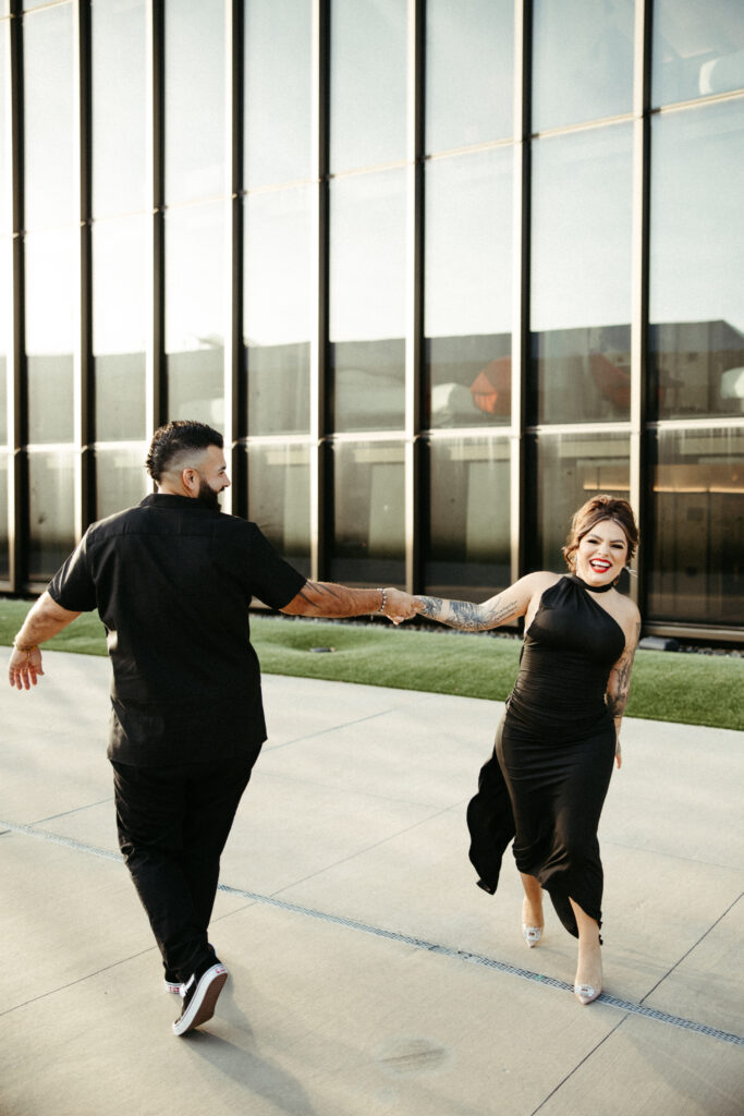 Engaged couple enjoying the moment, surrounded by the nostalgic atmosphere of the TWA Hotel.