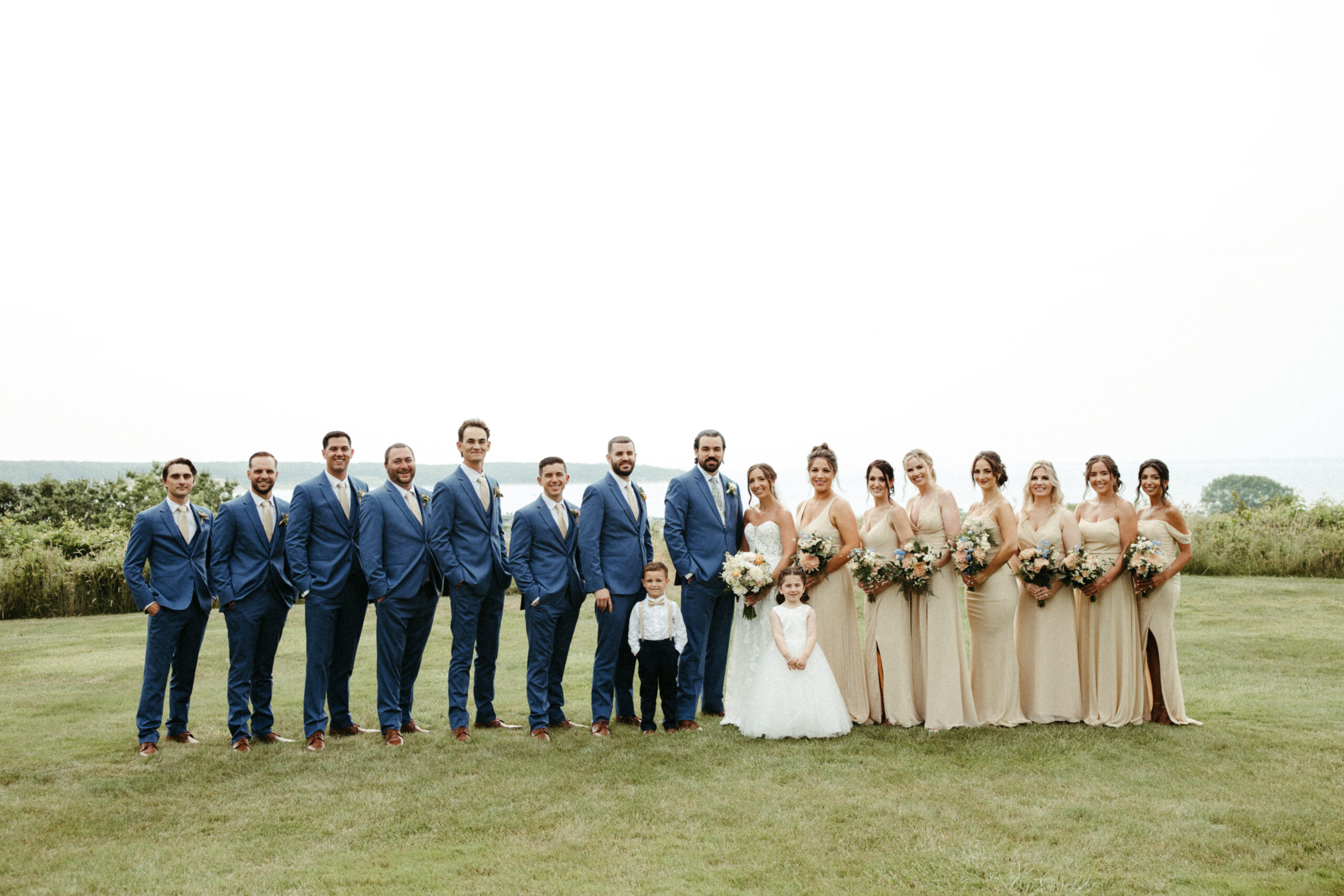 The full wedding party pose for a group portrait.