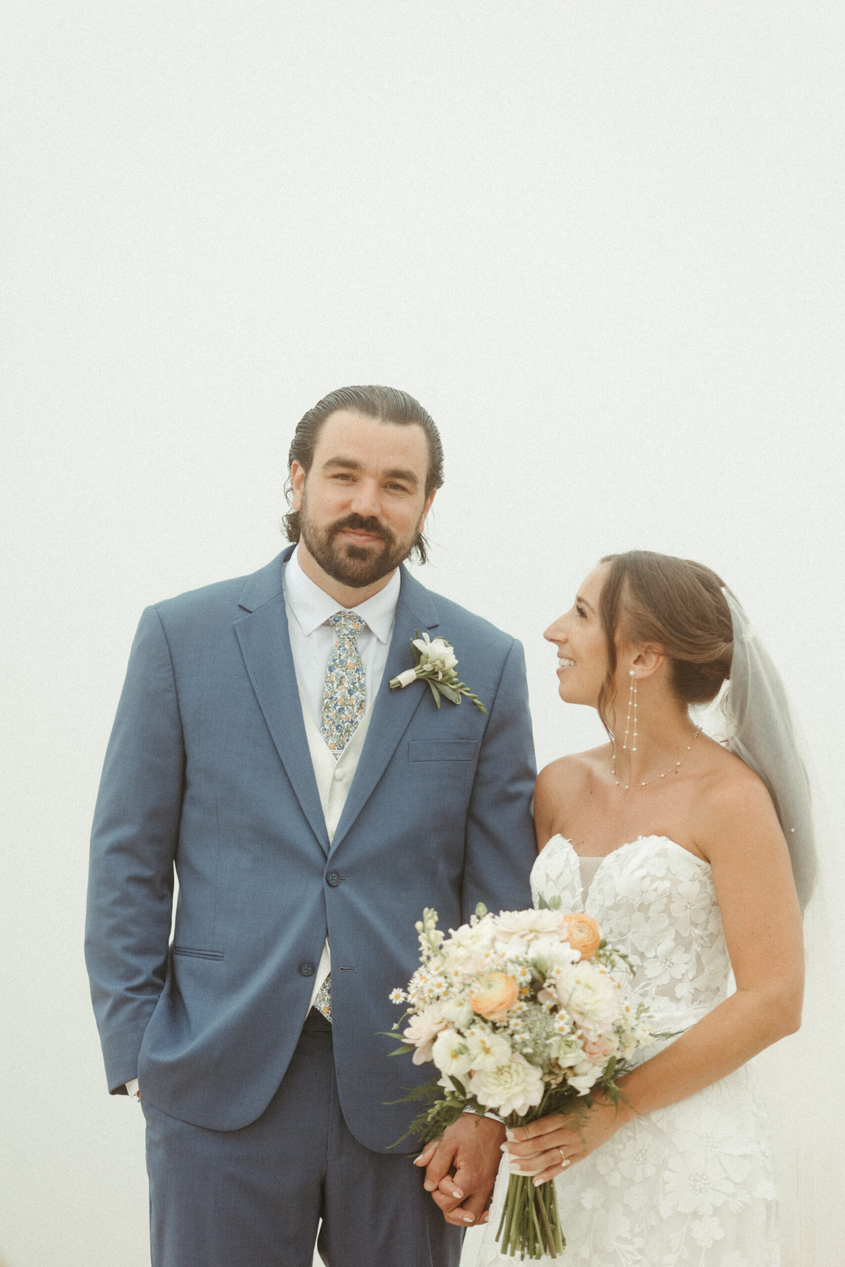 A candid image of the couple laughing together, lost in the moment.