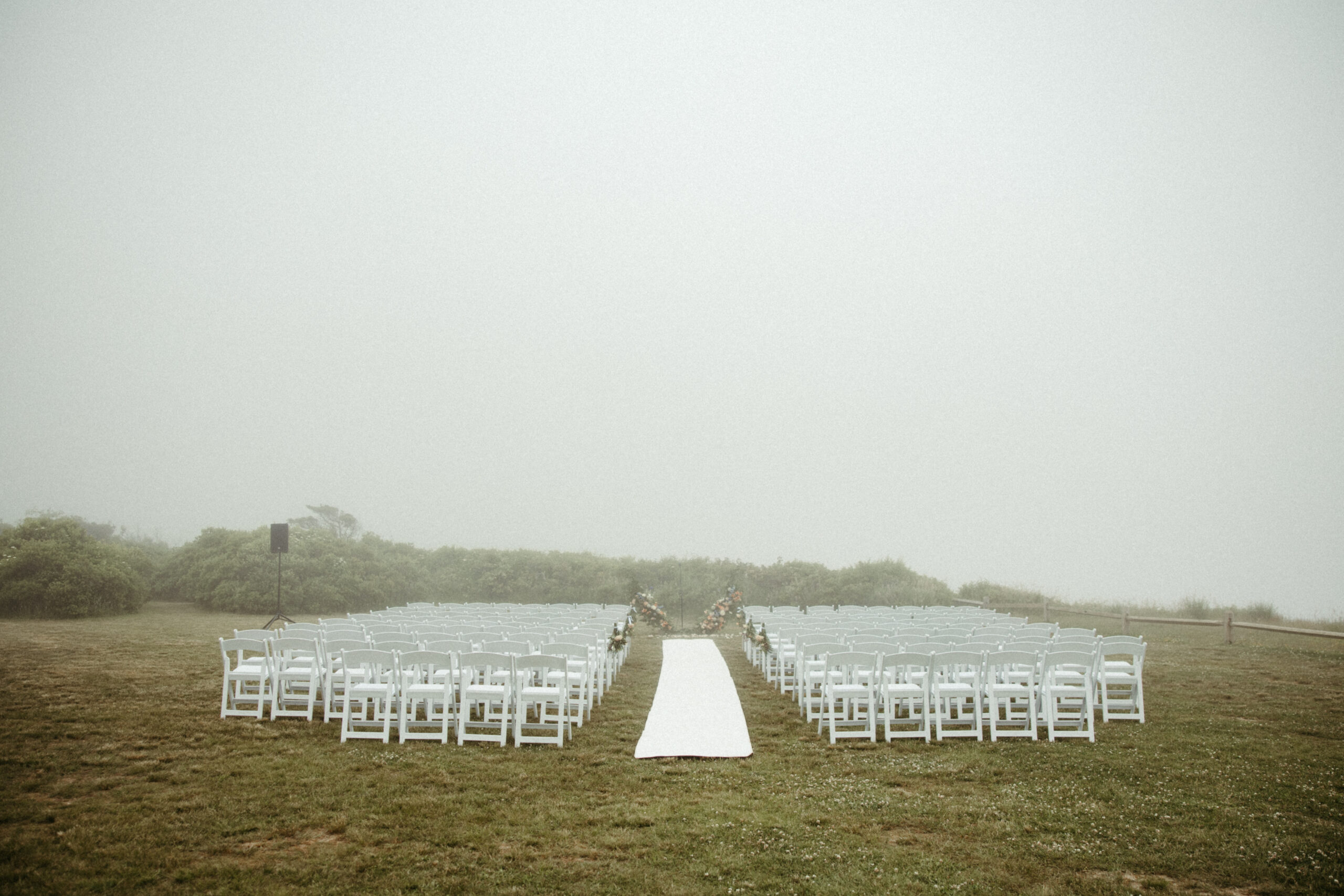 Ceremony setup at Camp Hero State Park draped in a heavy fog.