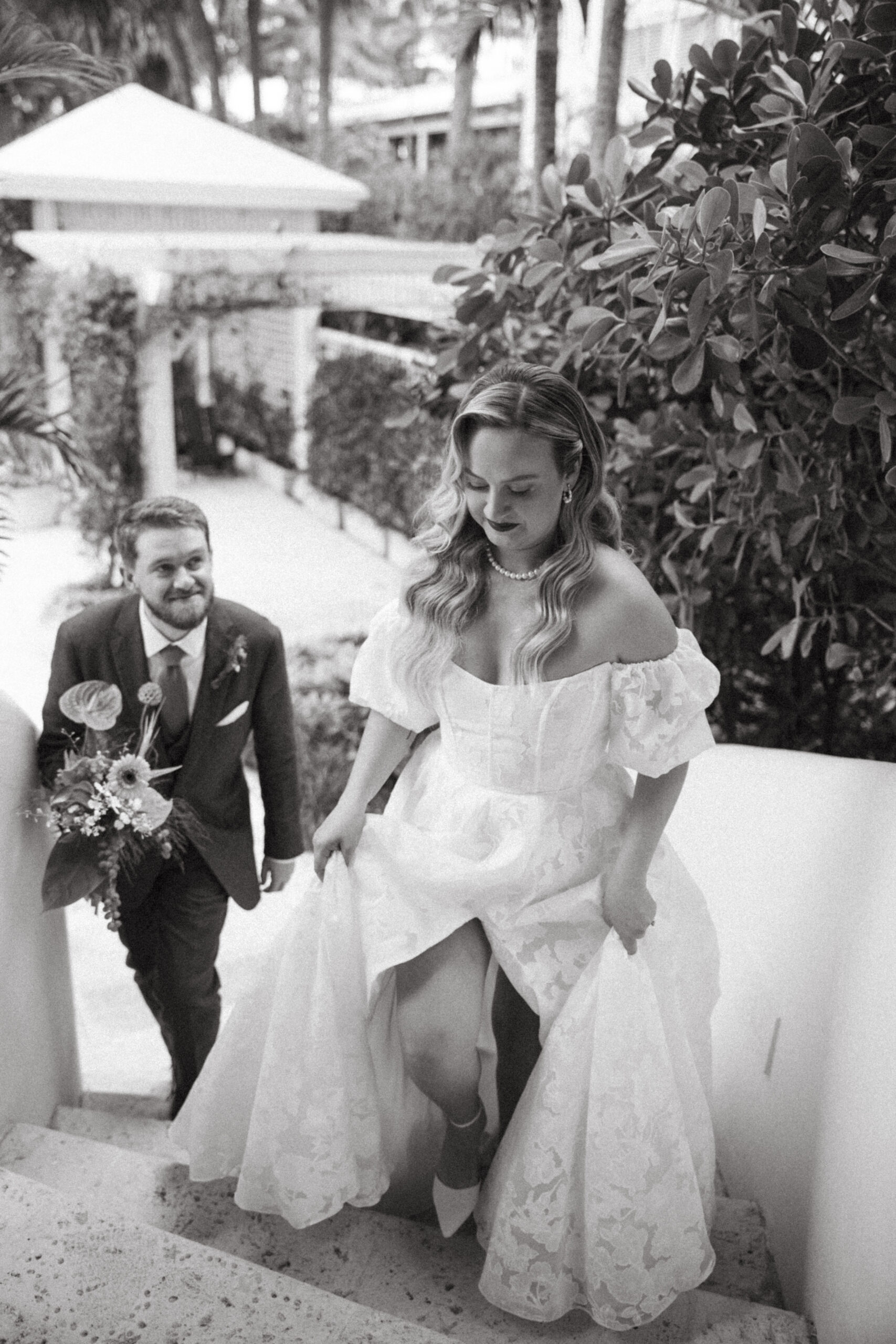 A groom stares adoringly at his bride unbeknownst to her telling their love story in one photograph.